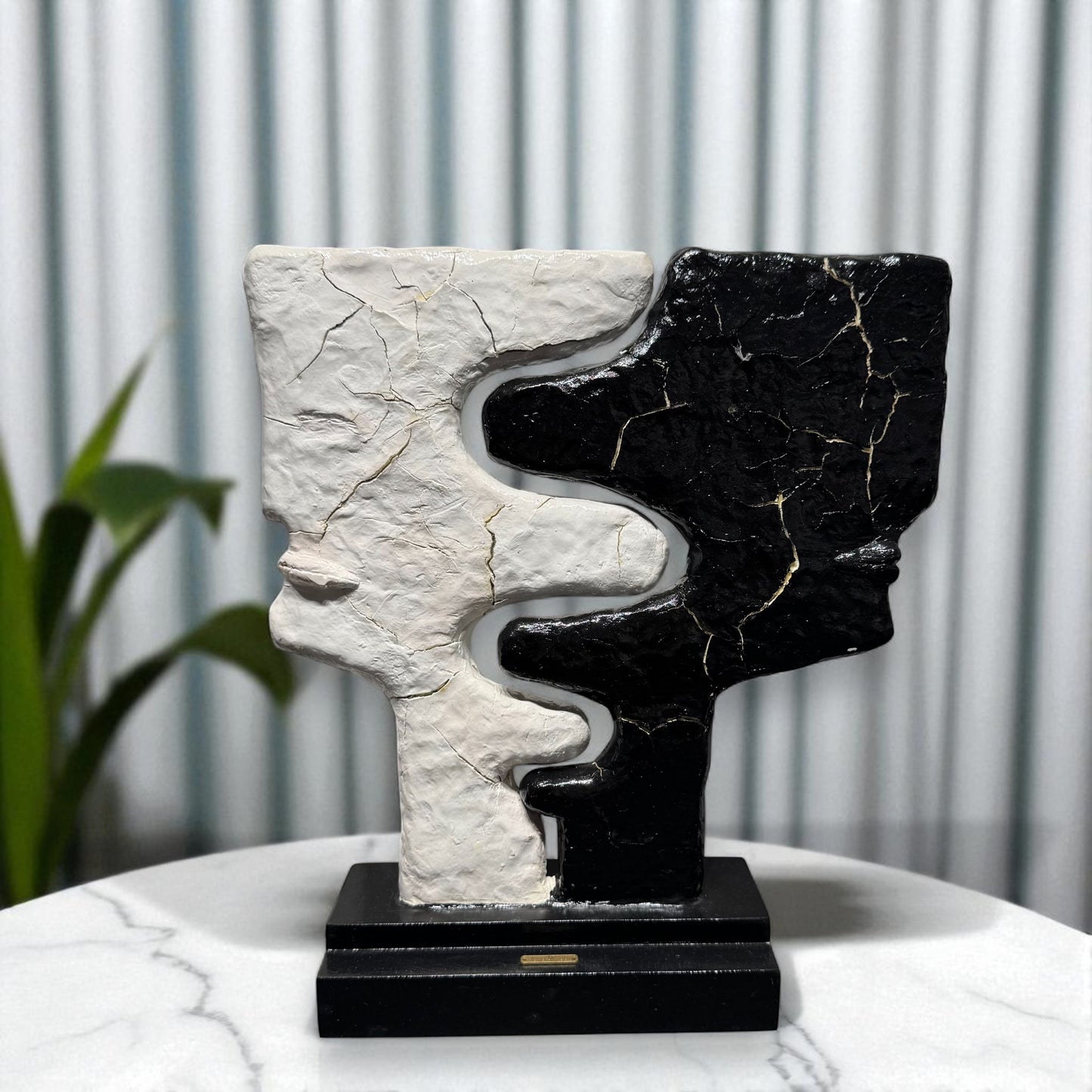 Abstract sculpture with black and white patterns