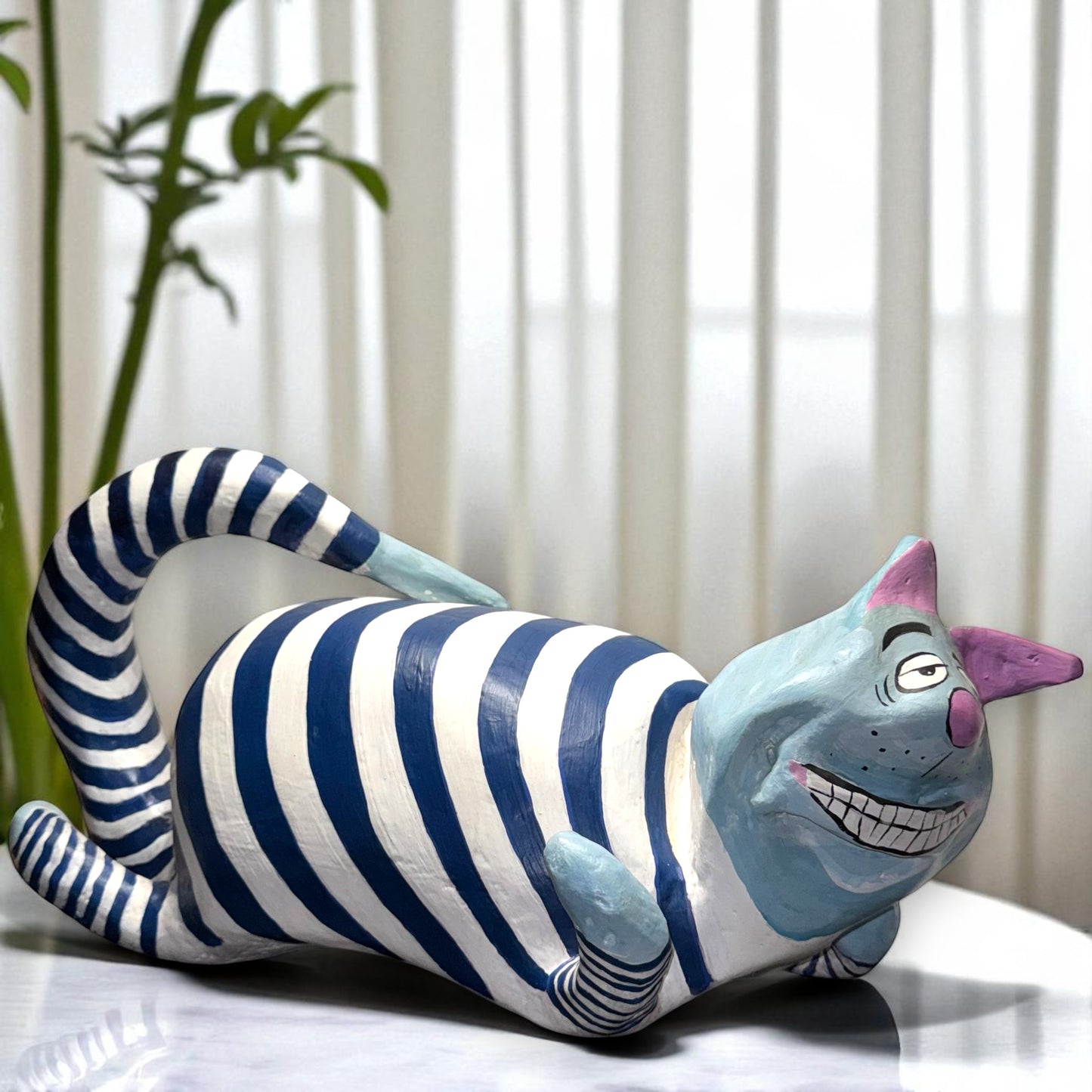 Striped cat-shaped sculpture