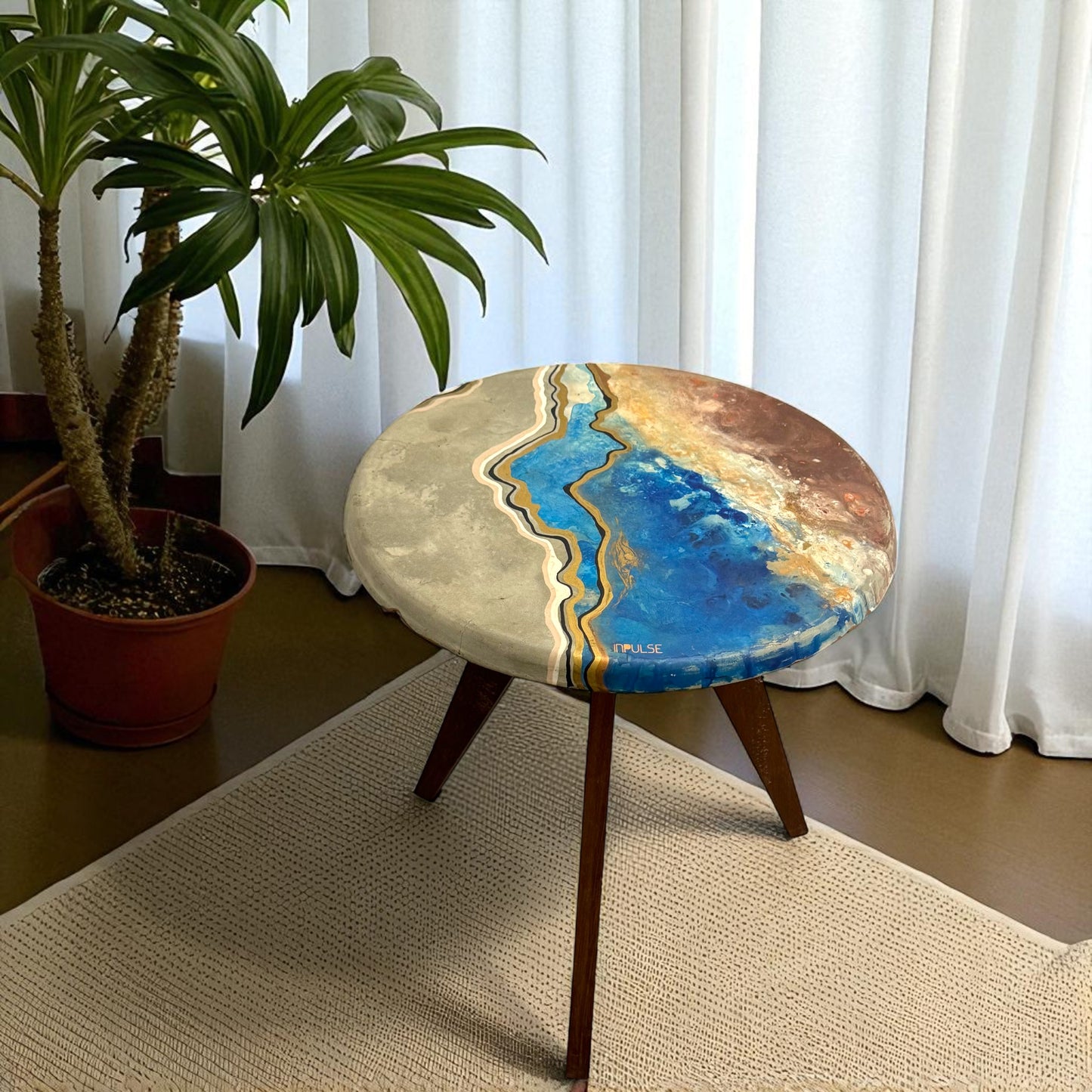 Round table with artistic surface design
