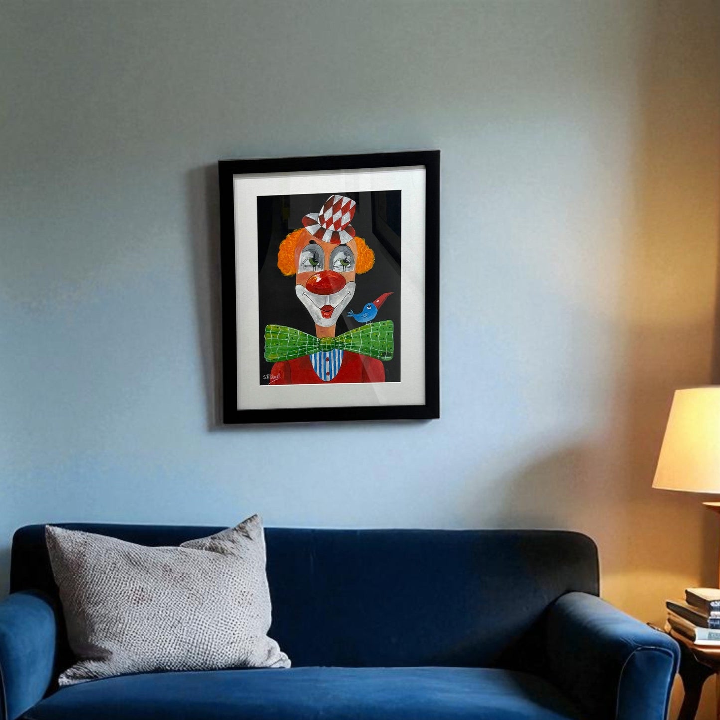framed artwork of an orange clown with a bird