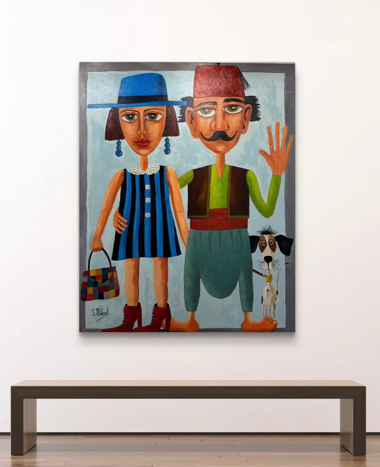 Framed artwork of two stylized figures and a dog 