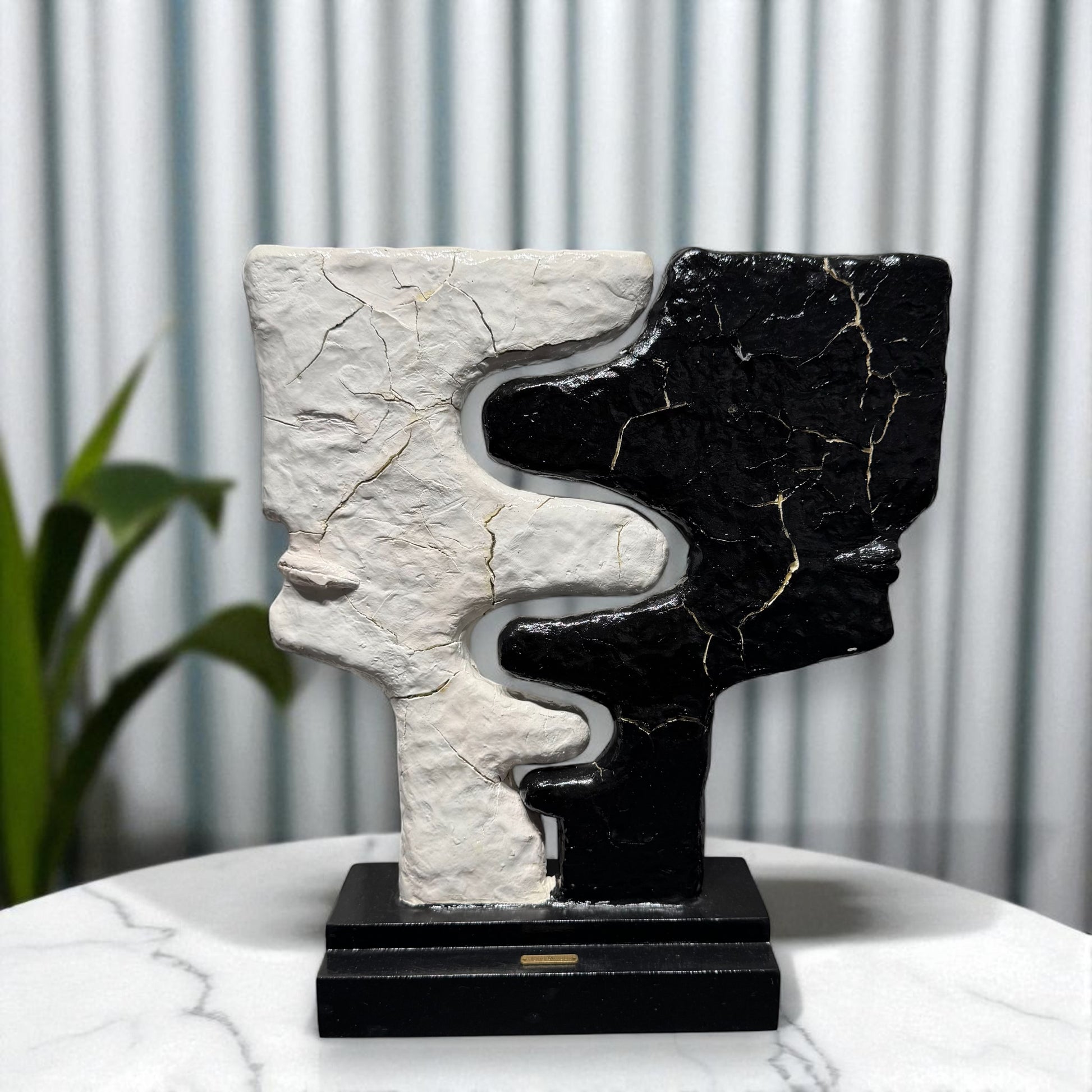 Abstract sculpture with black and white patterns 