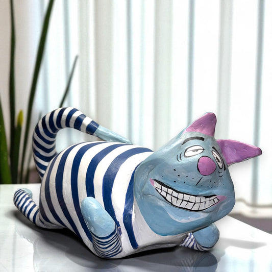 Striped cat figurine with a smiling face 