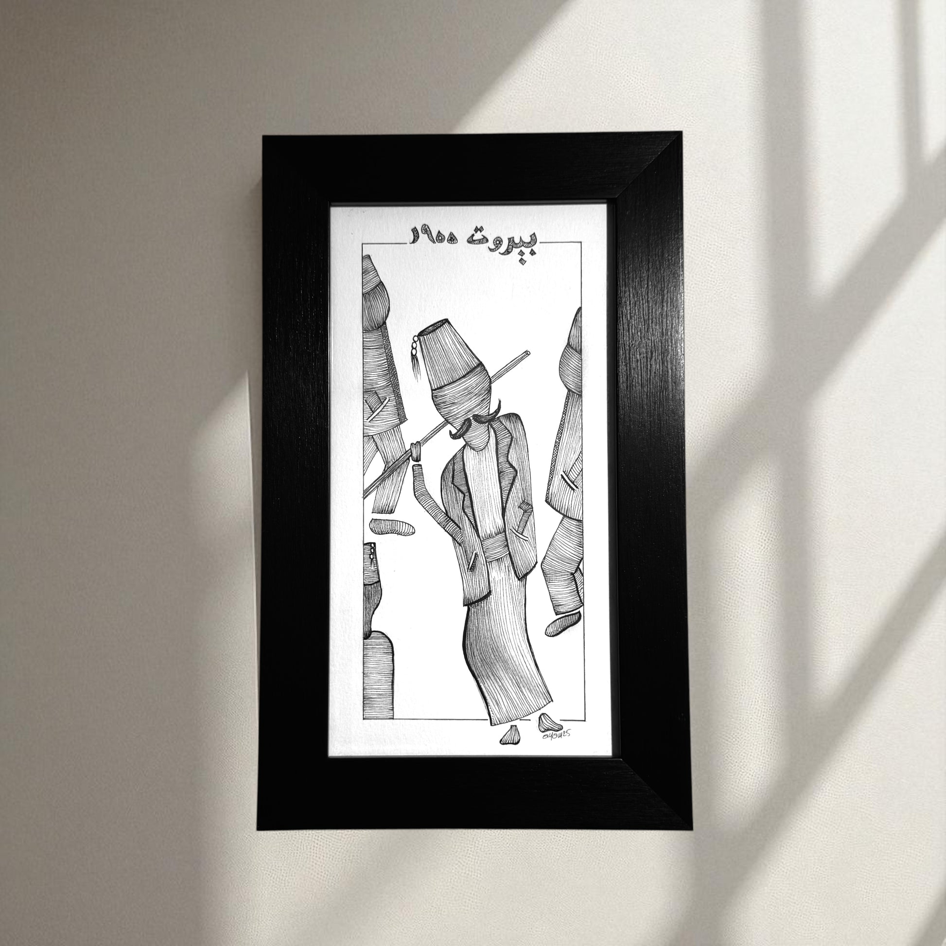 Framed black and white artwork of a person with a traditional hat 