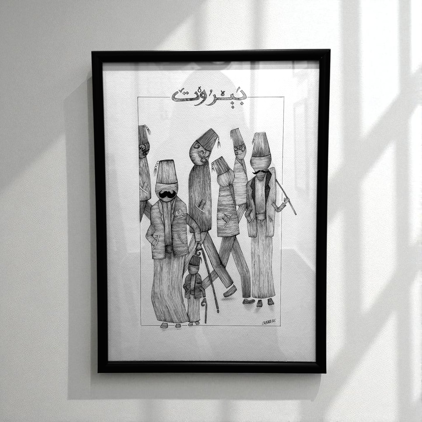 Framed black and white artwork of stylized figures 