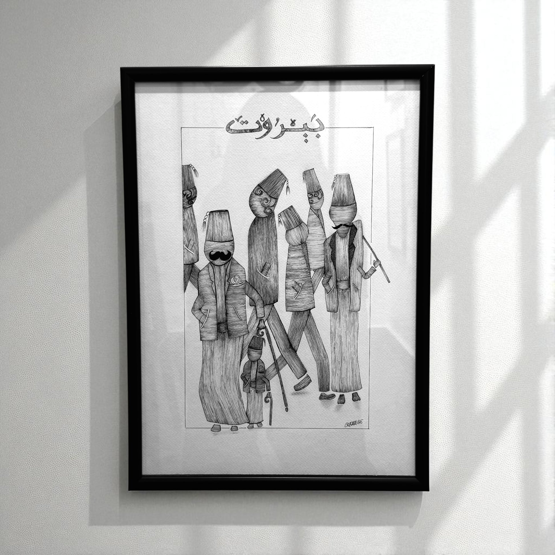 Framed black and white artwork of stylized figures 