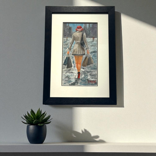 Framed artwork of a Lady with shopping bags 