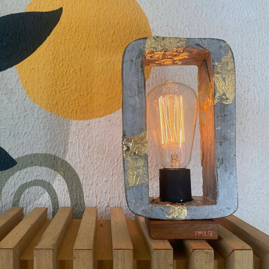 Rectangle table lamp with a yellow bulb 