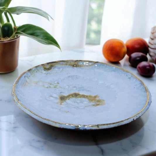Ceramic plate with gold rim 